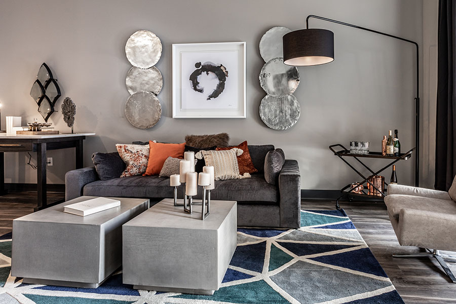 You can call the maintenance team whenever something breaks. Modern gray living room at Spark Apartments