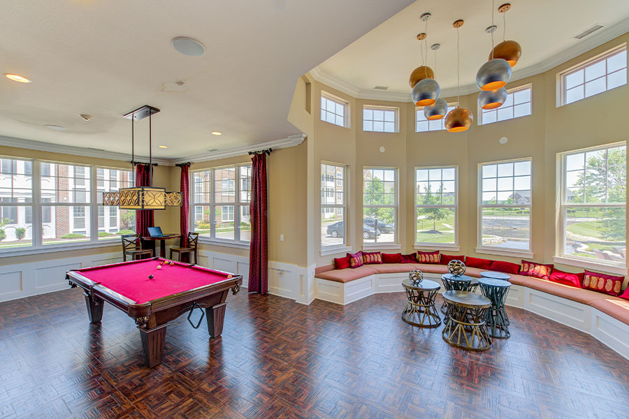 Elegant and comfortable recreation room. Just like the one at Hamilton Luxury Apartments. Red and beige recreation room at Hamilton Luxury Apartments.
